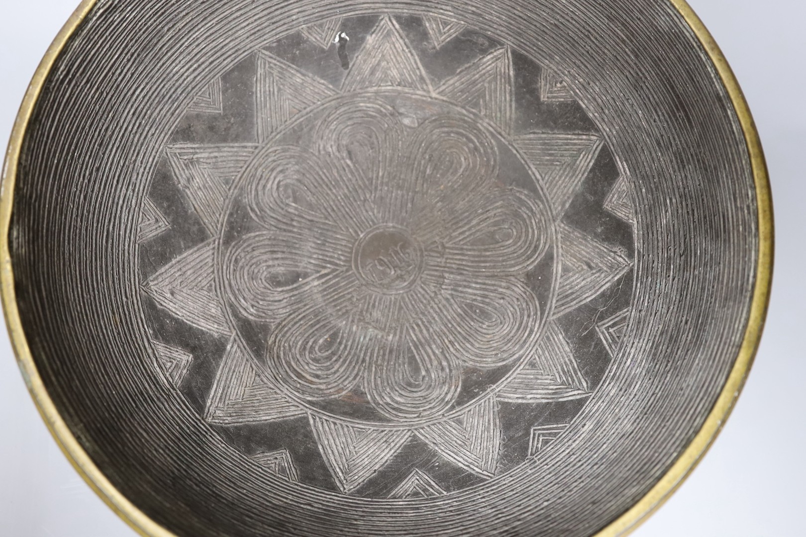 A Himalayan bronze ritual vessel, possibly Tibetan, inscribed 1916 to the interior , 36cms diameter.